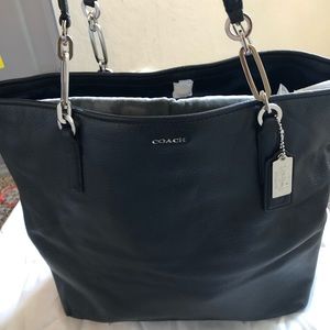 Coach leather tote.  New with tags.  Black.  Measures  17x1/2L  by 13H